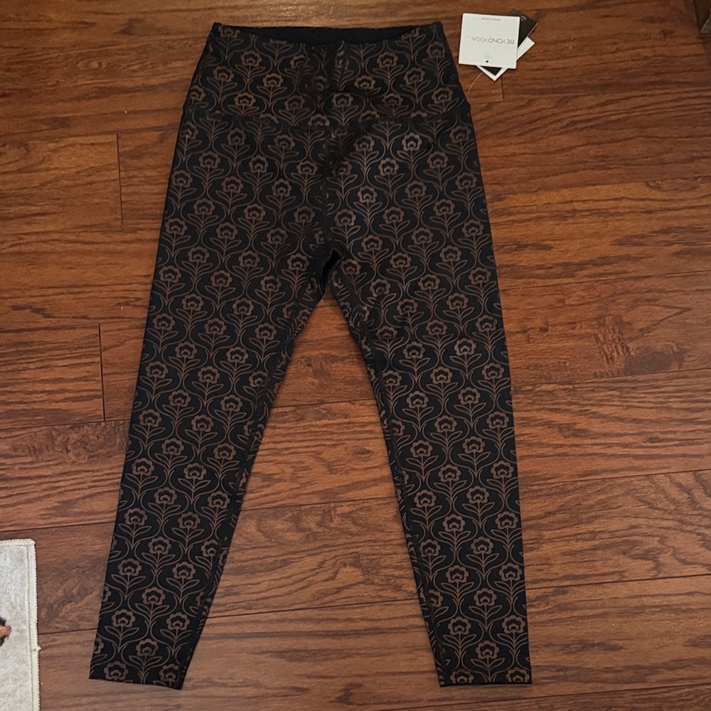 Beyond Yoga Black and Gold Patterned Leggings NWT